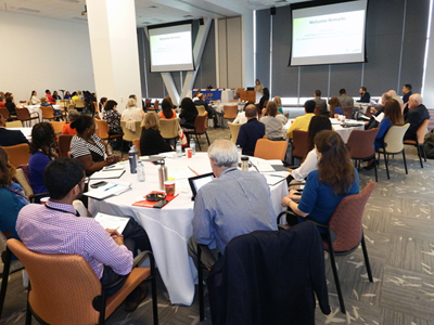 A photograph of people attending the Philadelphia Summit on Pediatric Home Asthma Interventions