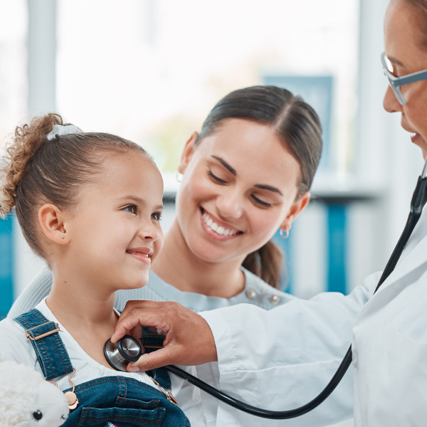 A mother with her daughter are at the doctor's appointment. 